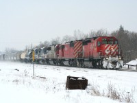 In the snowy and cold winter of 2008 (much like that of 2014), a CP westbound rolls through the wintery landscape at Ayr with an interesting lash-up: CP 5836 leading a "red barn," CP 9003, followed by a white SOO SD60 and two ex-LMX GE B40-8s.