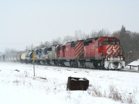 In the snowy and cold winter of 2008 (much like that of 2014), a CP westbound rolls through the wintery landscape at Ayr with an interesting lash-up: CP 5836 leading a "red barn," CP 9003, followed by a white SOO SD60 and two ex-LMX GE B40-8s. 