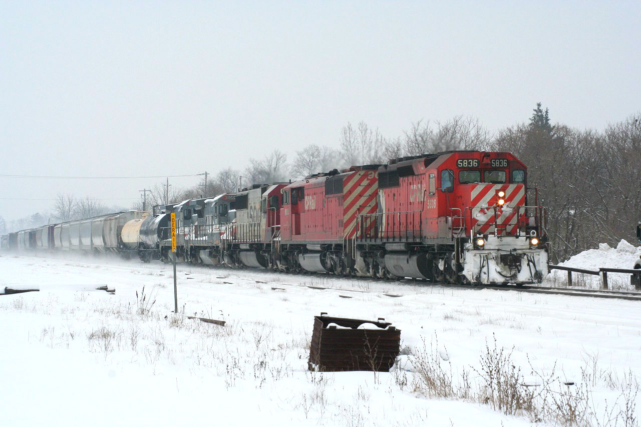In the snowy and cold winter of 2008 (much like that of 2014), a CP westbound rolls through the wintery landscape at Ayr with an interesting lash-up: CP 5836 leading a "red barn," CP 9003, followed by a white SOO SD60 and two ex-LMX GE B40-8s.