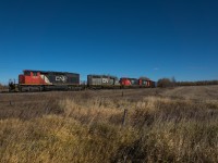 CN 419 approaching Busby Alberta on the Westlock subdivision.  After hearing some activity on the Dunvegan subdivision while watching Walker Yard we decided to head north and see what we could find.  After seeing this lashup roll through Morvinville we chased it further north to this location.
