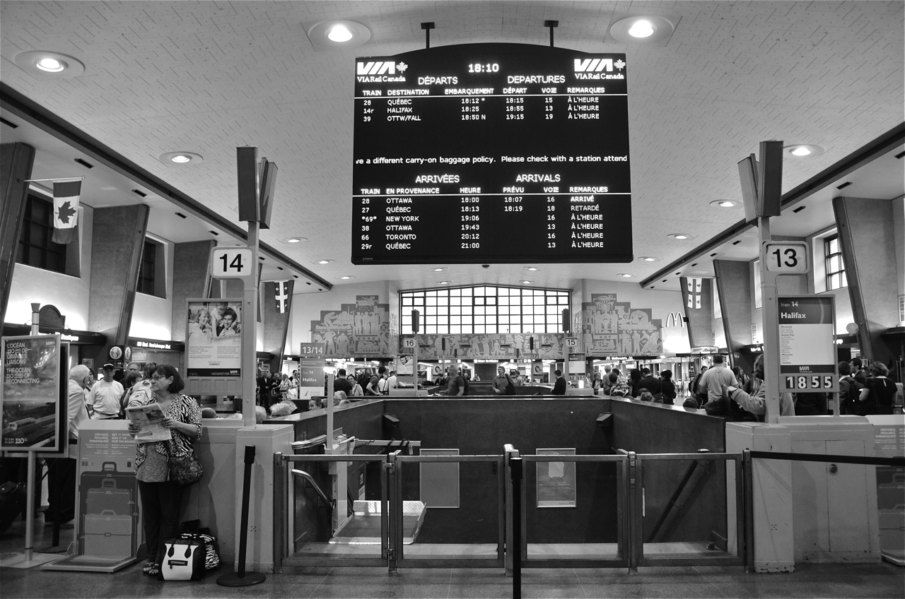 Boarding VIA 14 on track 13. Built by CN and owned by CN from 1942 to 2007 (it's now owned by Homburg Canada), Central Station in downtown Montreal is undoubtedly Montreal's busiest train station and Canada's second busiest, after Toronto's Union Station. It is served by AMT commuter trains to two destinations (Deux-Montagnes and Mont St-Hilaire) as well as VIA and Amtrak trains. At right is a sign for the 6:55 PM departure of VIA 14, 'The Ocean' for Halifax. In the middle is the arrival and departure board.