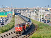 CN 711, with empty tankers bound for interchange to BNSF at Chicago, heads west through Montreal with CN 2687, CN 5456 & CN 2036 (still in UP paint).