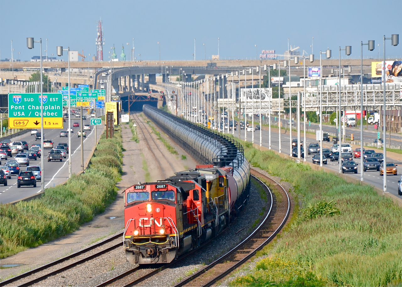 CN 711, with empty tankers bound for interchange to BNSF at Chicago, heads west through Montreal with CN 2687, CN 5456 & CN 2036 (still in UP paint).