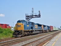 <b>Big mac attack!</b> CN 327 passes through Dorval with a mind-blowing for Canada lashup of an SD80MAC and an SD70MAC (CSXT 4593 & CSXT 4758). CSX only has 12 SD80MAC's (one was wrecked and retired) and they usually stay in the Appalachians, so this could be the first time one enters Canada. At left is the lead engine of CP 112 on the parallel CP Vaudreuil Sub (CP 8729).