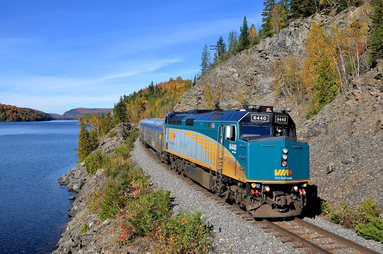 Off the beaten path. A rarely photographed but very scenic line which has almost no daytime traffic is CN's La Tuque Sub in northern Quebec. Here we see VIA 6440 leading VIA 604, the train from Senneterre past a very scenic rock cut at Lake Masketsi. In under half an hour it will be joined with VIA 600 from Jonquière at Hervey-Jonction and the combined train will head to Montreal, about an hour late.