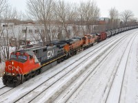 CN 710 with CN 2682, BNSF 6514 & BNSF 6674 heads east through Ville St-Pierre. It will stop at Turcot West in a couple of minutes to change crews before continuing on towards Joffre Yard. Waving is fellow railfan and recently qualified CN conductor Nicolas Houde.