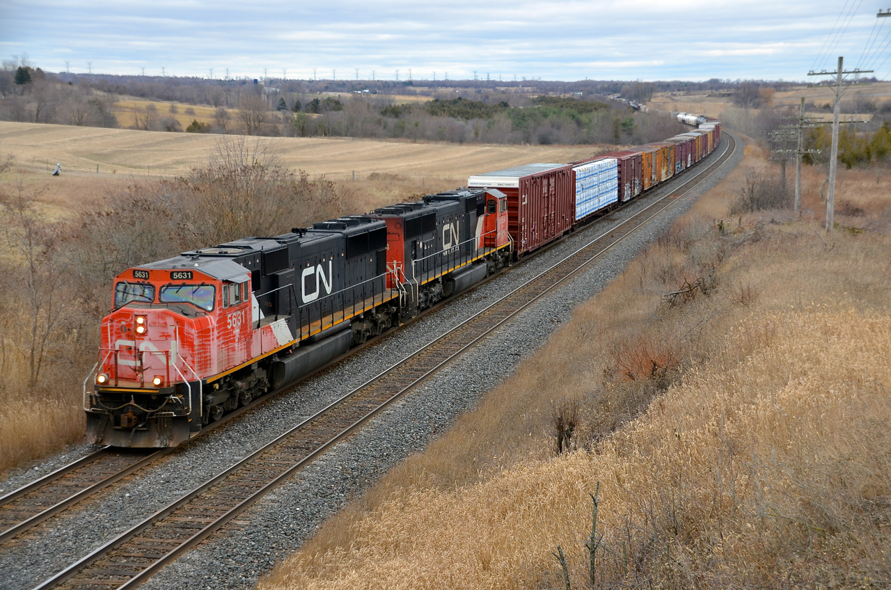 CN 5631 & CN 5654 lead CN X371 through Newtonville.
