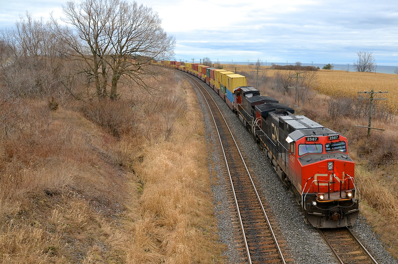 CN 2587 and another Dash9 lead CN 149 through Lovekin.