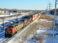 CN 149 heads west on the south track of CN's Kingston sub with an SD60F leading two GE's (CN 5527, CN 2014 & CN 2670). In a couple of minutes it will meet CN 310.