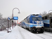 AMT 1351 leads AMT 112 towards its station stop at Montreal West before continuing towards downtown Montreal. At right is AMT 41, bound for Beaconsfield.