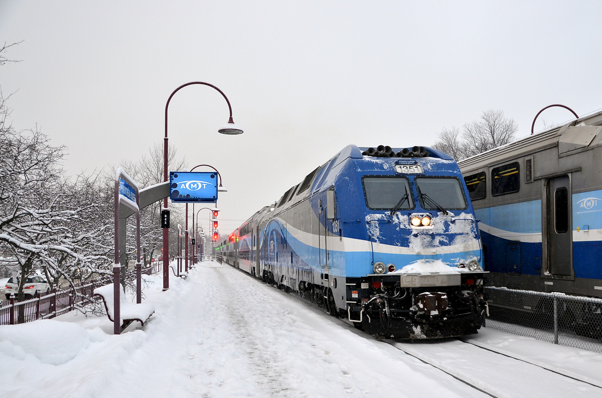 AMT 1351 leads AMT 112 towards its station stop at Montreal West before continuing towards downtown Montreal. At right is AMT 41, bound for Beaconsfield.
