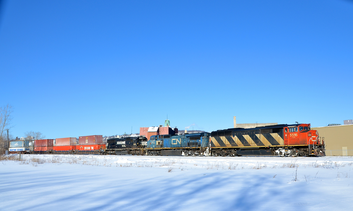 Lots of variety here. The train is 15 seconds away. It's -20 C. You take a test shot. And...... your freshly charged battery is already dead. Time to drop your gloves and changes batteries FAST. I managed to recover quickly enough to shoot CN 120 eastbound through St-Henri in Montreal with an incredible lashup consisting of CN 5516, IC 2457 and NS 2522.