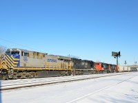 CN 527 is switching at the western end of Southwark Yard in St-Lambert with CREX 1205, NS2549, CN 5875 & CN 5632. The last two units will head to Toronto on CN X321. The first two units will head to nearby Taschereau Yard with a local transfer (CN 527). The Citirail and NS units entered Montreal on CN 529 Friday morning. On Friday afternoon they left for Richmond, Qc on CN 394 and CN 393 only made it as far as Southwark yard before having to tie up, which explains why the power was in Southwark.