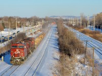 CP 143 heads west through Pointe-Claire with two CP AC4400CW's, CP 9822 and another unidentified unit. 
