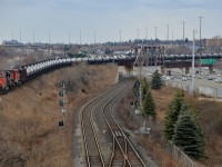 CN 2296 leads CN 710 on the last stretch of the York sub before it joins the Kingston sub (seen at the far left) at Pickering Junction. In the middle is the GO sub and at right is highway 401. Twenty minutes later CN 711 would pass in the opposite direction, preceded by CN 369.