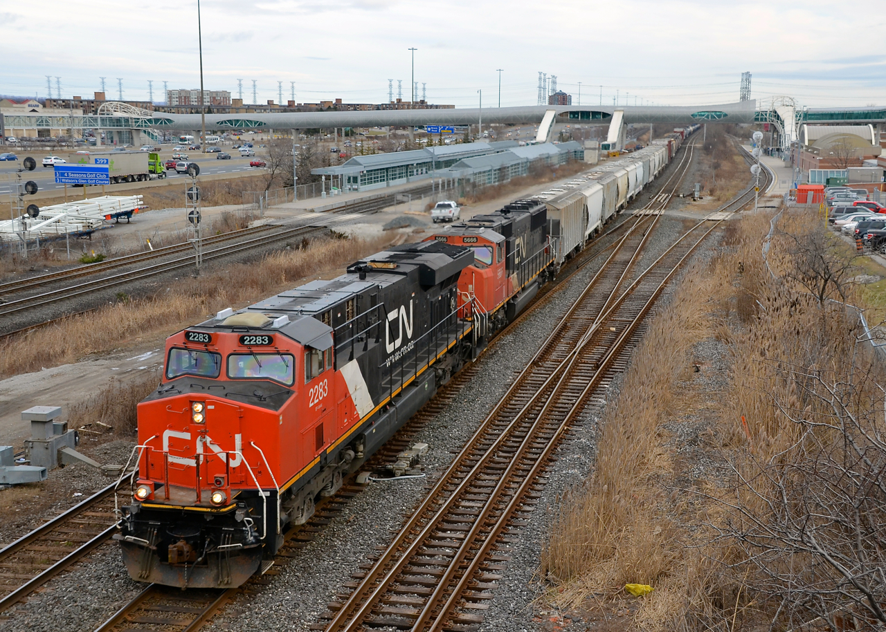 CN 2283 & CN 5666 lead CN 369 west through Pickering. Soon the train will leave the Kingston sub for the York sub.