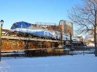 AMT 1366 is pushing AMT 807, inbound from Mont St-Hilaire, towards its 8:20 AM arrival at Montreal's Central Station. It is using a former lift bridge to cross the frozen Lachine Canal.