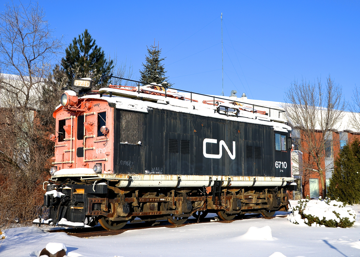 Displayed near the end of the line. CN 6710 was built by General Electric and delivered to the Canadian Northern as CNoR 600 in 1919. It was used on the Deux-Montagnes electrified line (which terminates nearby) until being retired in 1995. It is displayed in front of the Deux-Montagnes station, which still sees electric trains, but not locomotive hauled. This may change if AMT's new dual-mode engines are finally used on this line.