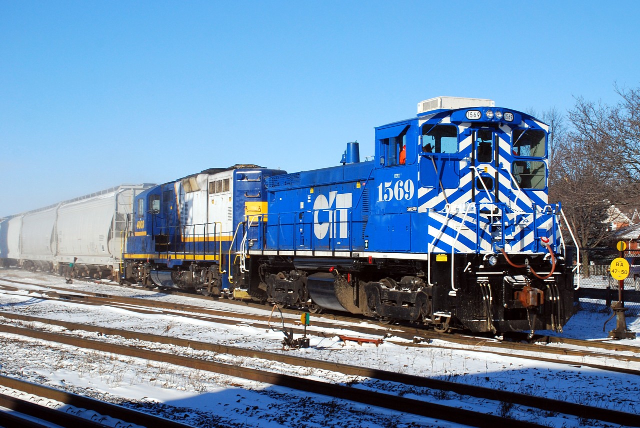 Today was the first day that the Southern Ontario Railway served the Burford Spur on behalf of Ingenia Polymers, the new owner of the line. RLHH 496 is seen backing 7 cars from Ingenia in to the CN yard. After a brief crew meeting, the power later returned light to Hamilton.