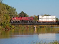 142 departing Welland makes it way across the Welland River on route to Kinnear.