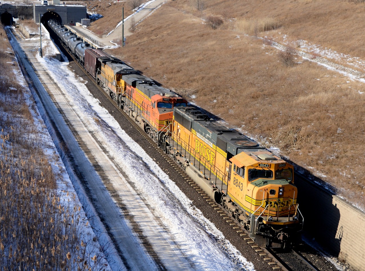 Train 710 exits the St. Clair River tunnel with BNSF 8843 leading followed by BNSF 7661 and CN 2001 trailing.