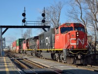 CN 120 exits the Vitoria Bridge and passes St Lambert station on its way east to Joffre, Moncton and Halifax on the last day of 2014.