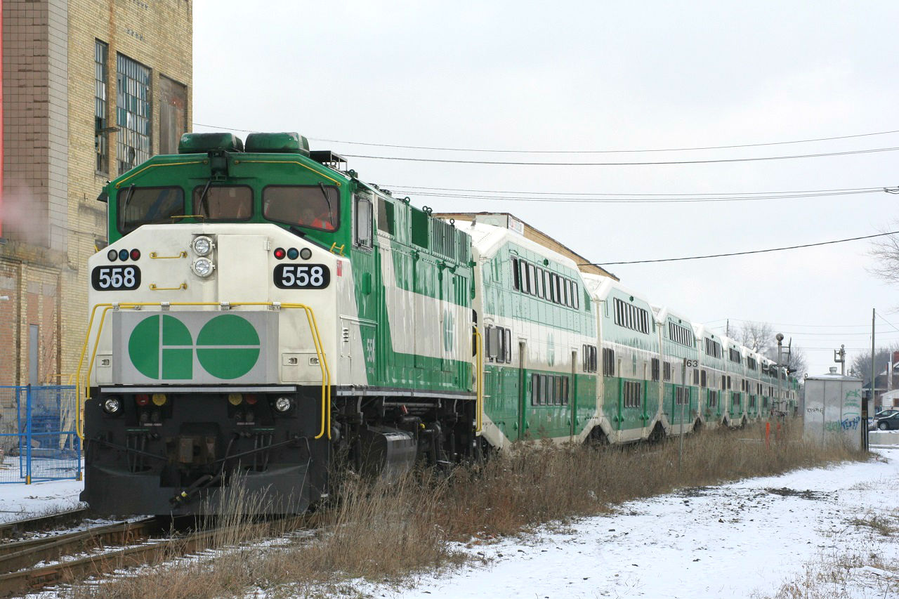 GO Transit's first run on the GEXR Guelph Sub. On the Sunday before the first day of regular GO train service between Kitchener and Toronto (December 19, 2011), GO ran an excursion for passengers. Here we see movement of the very first GO run from Kitchener, and an older GO F59PH brings up the rear.