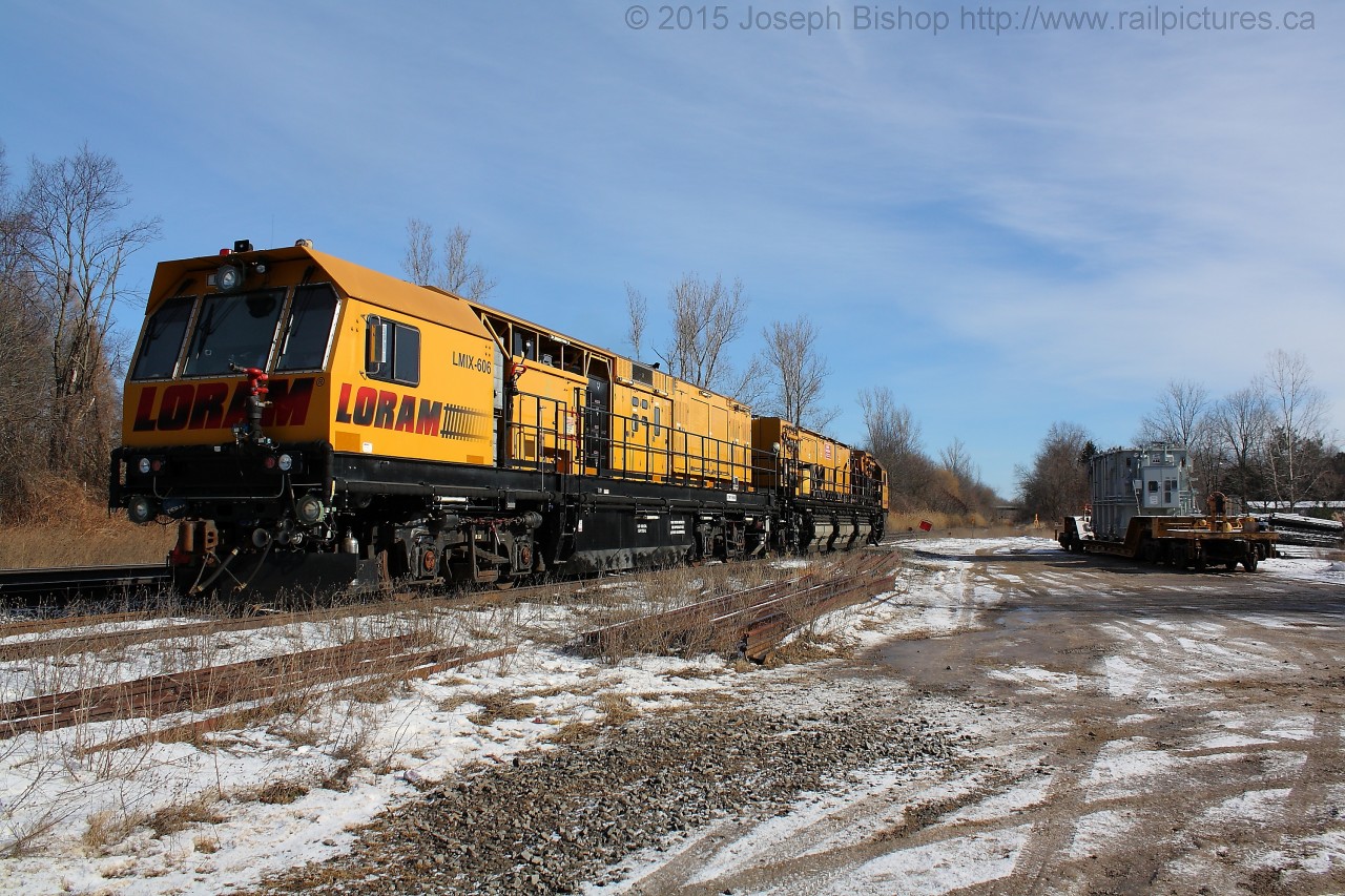 The Loram switch grinder sits in the siding at Copetown on a sunny Sunday morning.  Dad and I decided to swing by after the Ancaster Train Show and grab a few shots of it alongside the transformer that was set off by CN 580 on Friday.