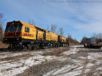 The Loram switch grinder sits in the siding at Copetown on a sunny Sunday morning.  Dad and I decided to swing by after the Ancaster Train Show and grab a few shots of it alongside the transformer that was set off by CN 580 on Friday.  