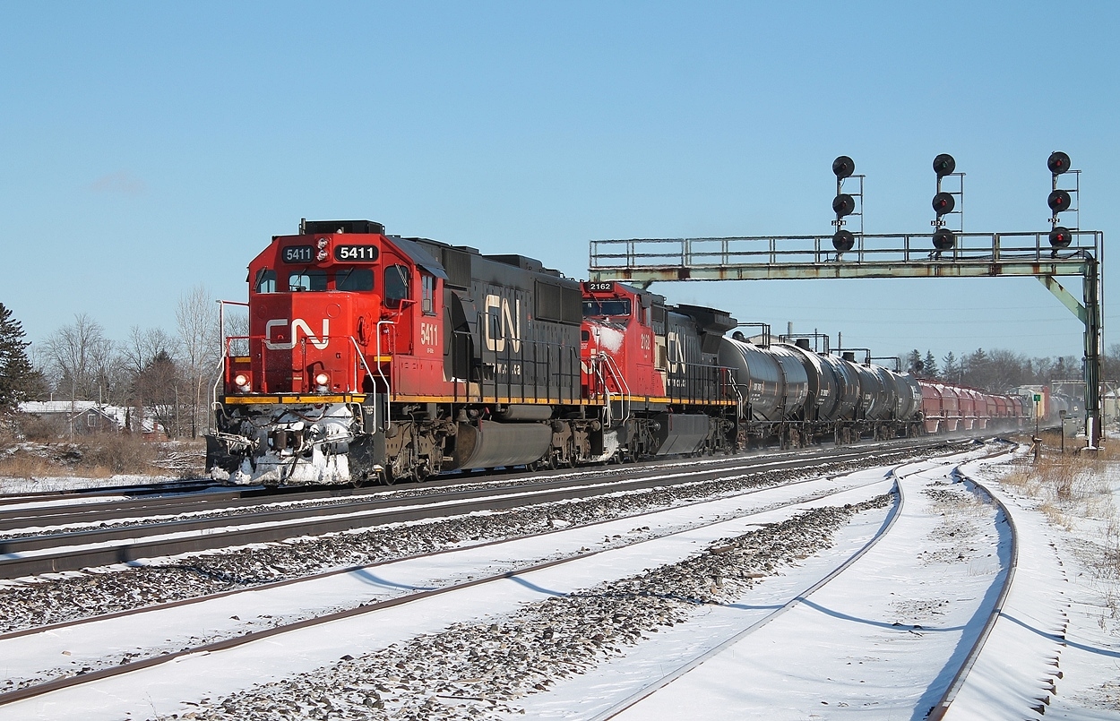 #331 approaching Paris yard to make a lift. CN 5411 and 2162 lead the mixed freight.
