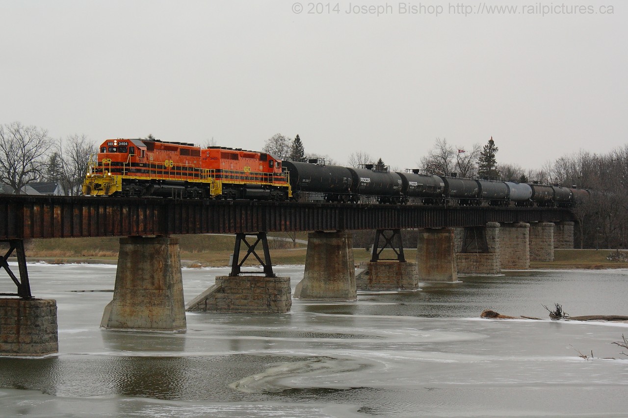 SOR 597 creeps across the Caledonia bridge with RLHH 3404 and RLHH 3403 keeping their train of 75 tank cars in check.  It was a gloomy first day of 2015 but the orange SD's added some brightness!  Thanks to James for the heads up this morning...made for a great first catch of 2015, here's to a great year!