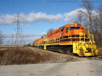 SOR 595 is seen passing Concession 5 Walpole on their way to Nanticoke with a train of tank cars that they assembled at Garnet earlier in the morning.  Leading the train is RLHH 3404, 3404 started its life as PC 6260 and saw service with Conrail, CR Leasing, Helm Leasing, DME and FURX.  It would be interesting to know if 3404 may have been through Ontario before but on the CASO as PC 6260 or Conrail 6260.