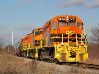 SOR 595 slowly approaches the Haldimand Road 3 crossing in Nanticoke Ontario with RLHH 3404, RLHH 3049 and RLHH 3403.  They have three cars for the US Steel Lake Erie Works which is located right behind the photographer.  The crew would wye their power within US Steel before emerging to begin building their train for Paris.  