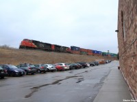 As the clouds pass Canadian National high priority intermodal train Q10451 is coming from British Columbia on the west coast of Canada with a SD75I leading. It has just come off of the Bala Subdivision at CN Doncaster Junction, and has a few more miles to go on the York and Halton Subdivisions before reaching its final destination of Brampton Intermodal Terminal in Toronto.