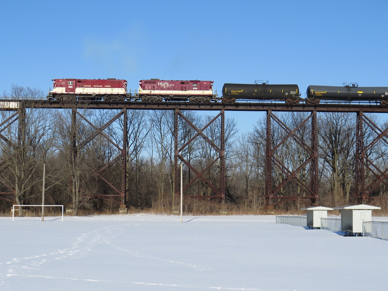 A pair of GP7's reverse back in to the yard to drop of their consist.