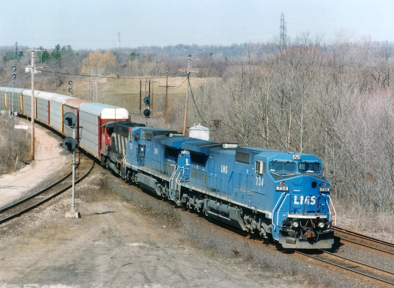 In the mid-90s; there were 25 Lease Management System units (LMSX) on lease to CN. Numbers 715-739. In 2001 CN took 728-739 on long-term lease, renumbered them into IC 2455-2466, and purchased them Oct 31/12, save for 2464, which was lost in a wreck. For a while, these bright blue Dash-8s were relatively common, but to get a pair of them up front was not. Here we see from the 'Point' at Hamilton West railfans lookout, on a most pleasant April mid-day, LMS 734, 738 and CN 9560 rolling eastward.