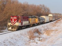 The OSR train is heading to Ingersoll from Woodstock with some mixed freight up front and a long cut of empty auto racks from CP 147's train. The sun is just about to set on this winter day. The OSR is a cool railroad operation!
