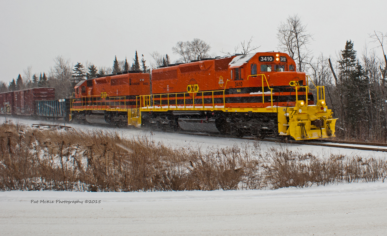 With the snow falling RLK 3410 leads with RLK 3409 trailing with a short train to Sudbury