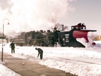 <br />
<br />
It looks like Pembroke had quite a snowstorm!  The crews are out in force and I’m guessing that it won’t be long before the tracks are clear again.  The late Del Rosamond captured this photograph at the Pembroke CPR stone station, circa 1959.  
<br />
<br />
For many years I’ve studied this image.  The focus is very soft – almost like a Wentworth Folkins water-colour painting.  You’ll notice that the faces of the men shoveling the snow have no definition… kind of ghostly in an intriguing way.
