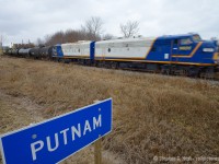 Engineer Larry Broadbent notches up his pair of 16-cylinder EMD 567c powered covered wagons, accelerating out of Putnam for 25 MPH track speed. The pair sure sounded good as they growled in unison.
<br><br>
The weather was dull and dreary - and this was my last shot until St. Thomas - but the sun did <a href=http://www.railpictures.ca/?attachment_id=17472 target=_blank>appear eventually .</a> 