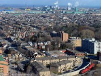 The time is 11:36. The third of three images of my 36 minutes of action and my last train photo of 2014. I realized fairly quickly after I was done with US Steel/Stelco that I could possibly make it up here for my last angle. Could I do it? Light traffic for the holiday season made it possible. In this scene TH31 is about to finish for the day arriving at Kinnear Yard light power - the four cars seen earlier must have been set off in Adams Yard (by Ottawa and Burlington St).<br><br>At top left- just under the Burlington Skyway - those blue buildings is US Steel and is exactly where I was <a href=http://www.railpictures.ca/?attachment_id=17548 target=_blank>less than 15 minutes earlier</a>. The outbound yard is just to the right of the blue buildings and if you squint just right you can see six railway cars in the yard. Top Middle is Dofasco.  And at top right? That's National Steel Car (With Centre Mall in front) and my <a href=http://www.railpictures.ca/?attachment_id=17543 target=_blank> first photo</a> in this 36 minutes of action was taken just off the screen.