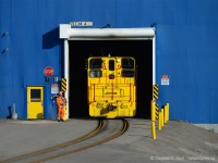 The time is 11:10 - 10 minutes earlier I was photographing CP near Strathearne (<a href=http://www.railpictures.ca/?attachment_id=17543 target=_blank>click here for photo</a>) when I heard sirens - sounded like the warning siren that goes off - as was the case as I took this photo - when the Transportation Department is in the plant with railway equipment. I was right and the wind was carrying sound just the right way. I made my way west down Burlington St just in time to catch the action.<br><br>
In this scene, the Beltpack operator at the yellow door has just switched #89 to reverse, the headlight turned on and the crew is about to remove 6 loaded coil cars from the "z" Galvanizing line and place them in the outbound yard. Note: SW900 #89 was delivered new to Stelco in 1964 and has been here ever since. No ditch lights, plenty of modifications otherwise (Antennae, a fisheye camera just above the number 8, and a blue strobe light which seemed inoperative)<br><br>
A Brakeman will ride the tail end of the movement into the yard - hence a two man crew. After, I realized I had one more shot to go for.. CP was returning to Kinnear after my shot at 11:00. Part 2 of "36 minutes in Hamilton."