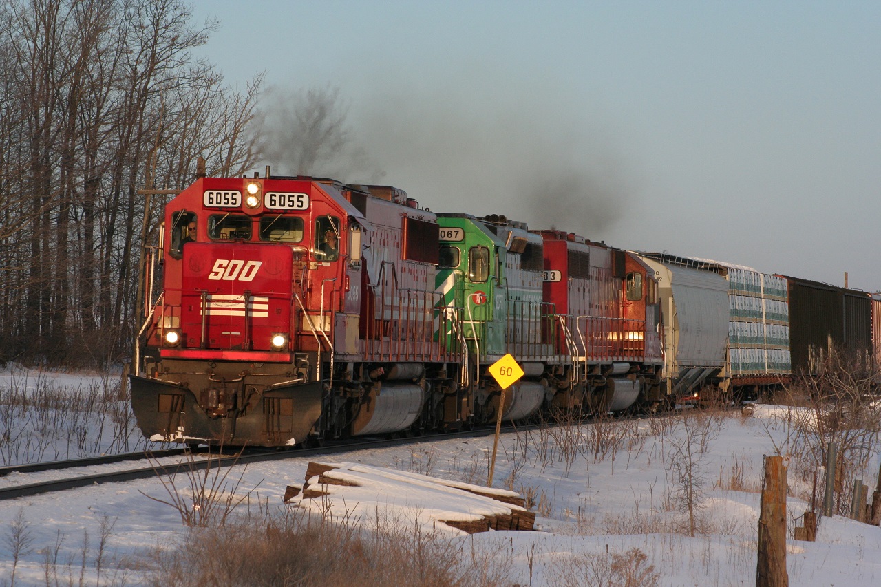 SOO 6055, GCFX 3067 and NREX 783 lead CP 245 west at the West Siding Switch Wolverton near the end of a nice winter day in 2008.