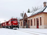 A nice way to end the chase, well sort of. The Havelock Job rolls through Peterborough, Ontario with a short 17 car train in tow. The former CPR station still stands, but not to passenger trains anymore that used to run the line years ago. The train will continue on with a one car set off behind the head end at Botulf to the east of town before heading to Havelock to finish the day. 