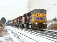 CP 550 with UP 3649, CP 8563, CP 6232, CP 9544, CP 8714, CP 5648, UP 4863 and UP 3984 finally came through at Orrs Lake. We were not picking up anything on the radio that they stopped at Wolverton to pick up some locomotives. Before CP 550 made it here, we were expecting just the UP 3649 and CP 8563. I apologize I should have sent an OS here but we chased the thing to Guelph Jct. So, I was heavy in chase mode; however, luckily there was an OS sent from Ayr that he was on the move again. Nonetheless, it was a killer catch and cool that we had no idea of the extra power until it got to us. Note the yellow tape at the back of the CP 9544. Does anyone know where the extra power came from? (what train?) Time, 12:00.