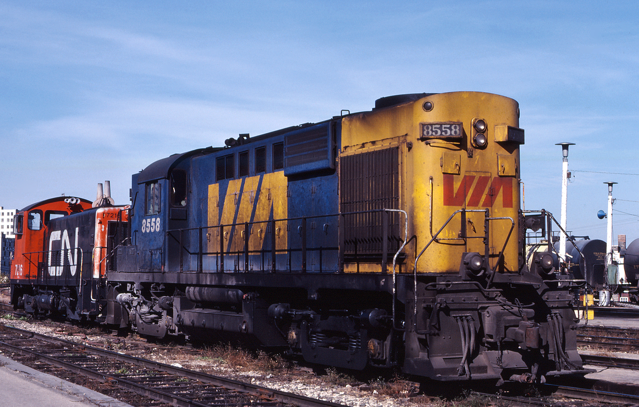 The one, and only VIA RS-10 8558, idles outside of the depot in Winnipeg, Manitoba coupled to CN 7716, one of the switchers assigned the station.  VIA had acquired their only RS-10 from CP as a replacement for FP9A 1408, which was wrecked before it was transfers to VIA.  Built in 1956, VIA 8558 was not long for this world and it was retired from VIA in 1981.