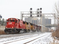 CP 6238, UP 3984, CP 9833 & CP 8533 , kicks up snow as it motors along pass Kipling.