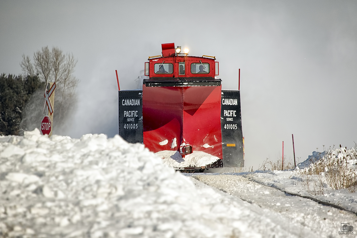 After Sundays snowstorm and not a single train down the St. Thomas sub, the Plow Extra was called to clear the line down to St. Thomas blasting and busting through drifts along the way. A second pass was needed to clear the cut a bit more.