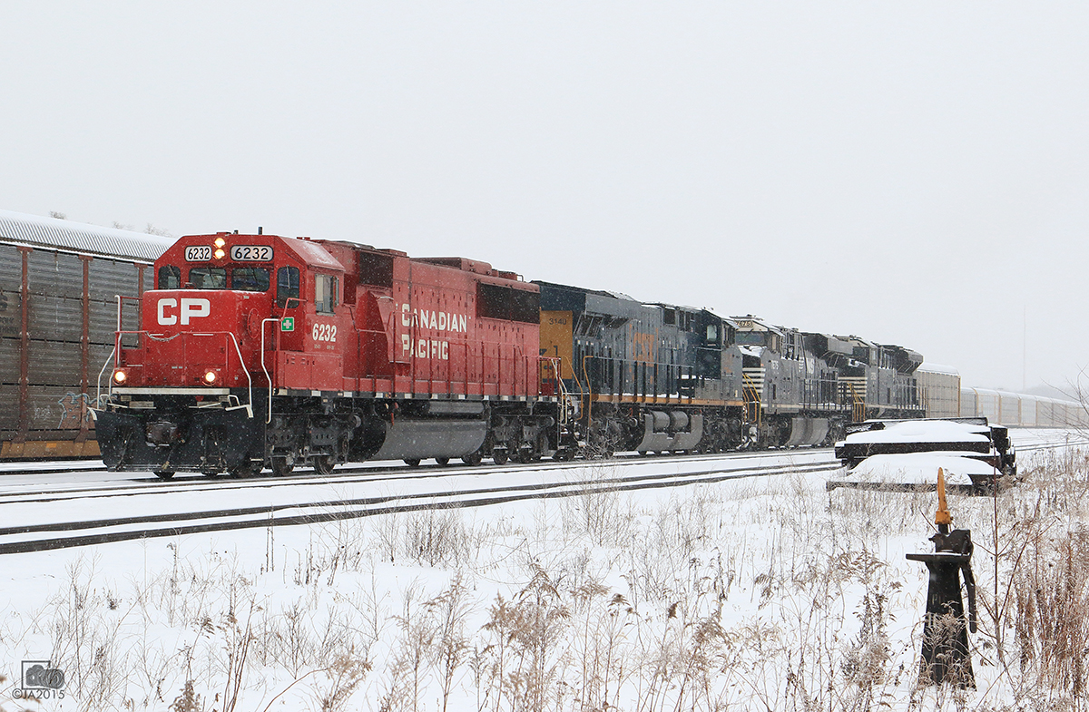 CP 6232, CSX 3140, NS 7675, NS 2705 power CP 147 as they work Lambton yard on a snowy Sunday afternoon