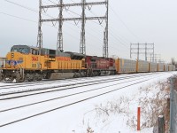 UP 3643, CP 9604 power CP 234, as they slowly creep up to the light at Kipling.